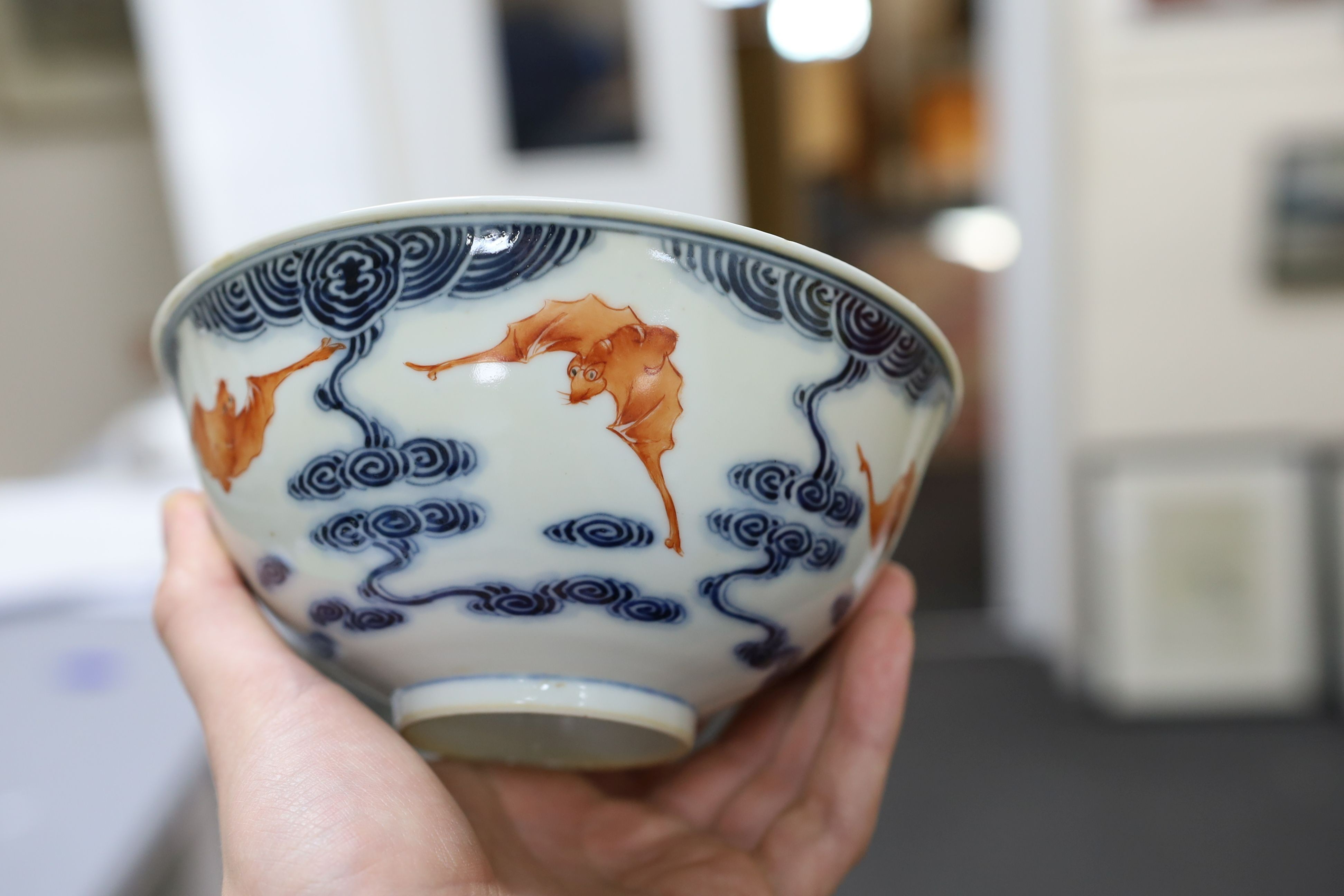 A pair of Chinese iron red and underglaze blue ‘five bat’ bowls, Guangxu mark and probably of the period (1875-1908), 16.5cm diameter